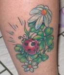 cartoon-ladybug-on-clovers-tattoo