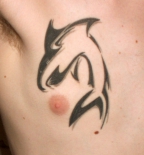latest-men-tribal-chest-tattoo-new-art-for-2011-520x557