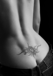 tribal-yin-yang-lower-back-tattoo