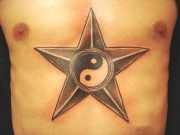 yin-yang-star-tattoo-on-chest-2388f5417f34b17705e38c4beead73b0fa5f2280