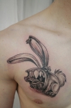 77378663_large_piercing_rabbit_tattoo_by_2face_tattoo