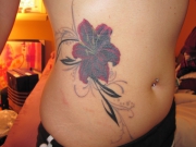 side-lily-tattoo