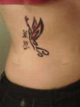 lower-back-tribal-butterfly-tattoo-9-girl-kanji