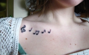 music-notes-chest-tattoo-girl