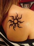 75969545_tribal_sun_tattoos1