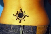 sun-tattoo-design-on-lower-back-for-women-2011-520x345